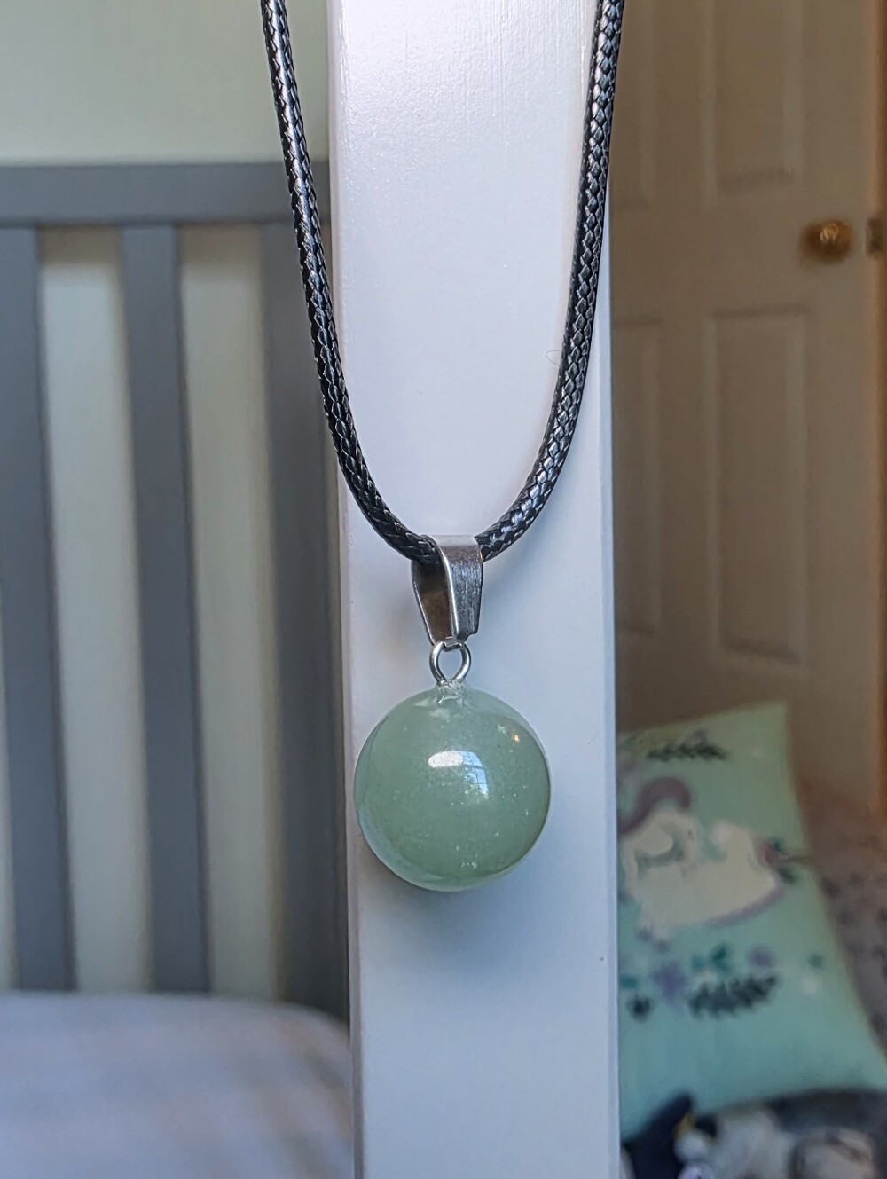 Green Circle Crystal Pendant On Black Cord Necklace